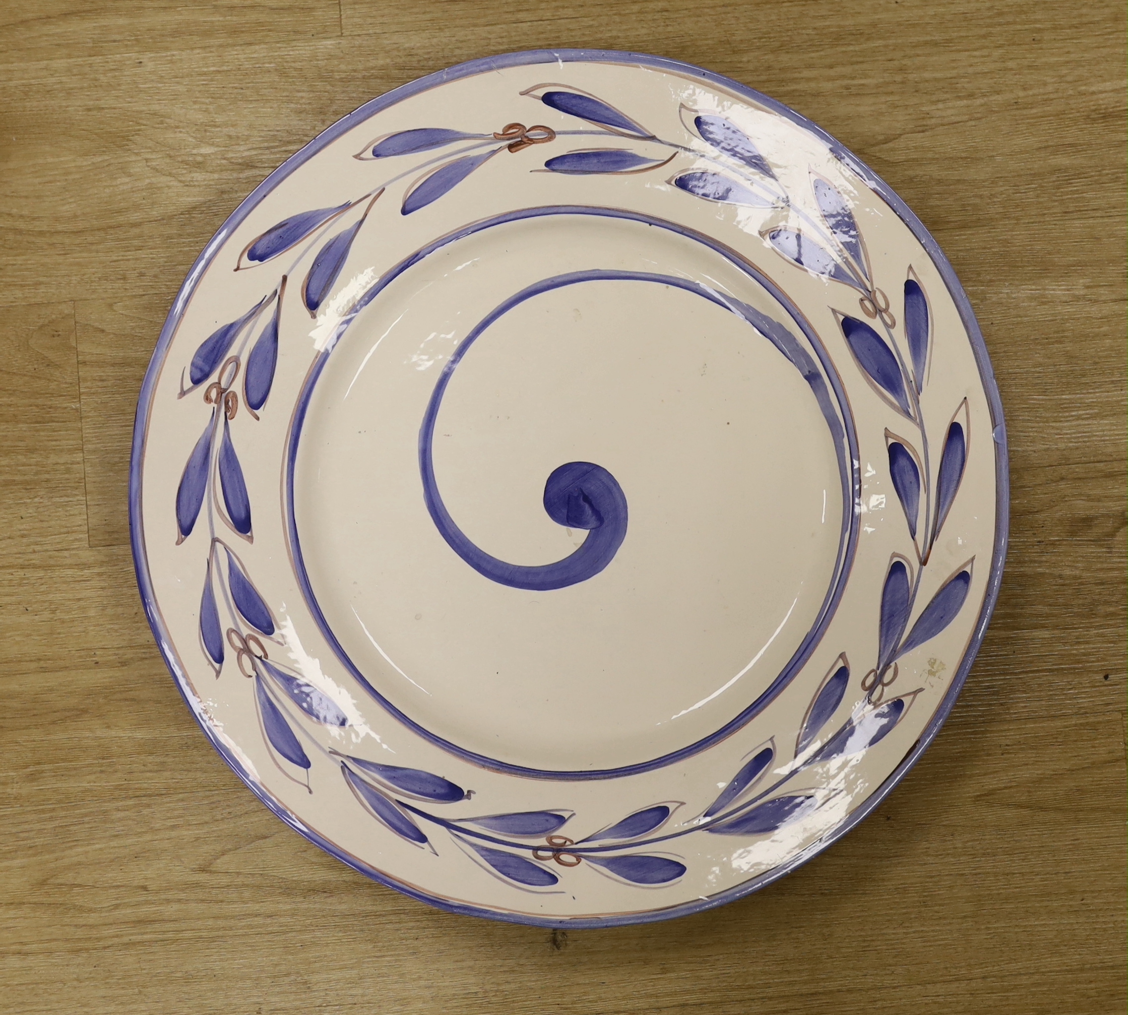 A large faience glazed charger, 60cm diameter